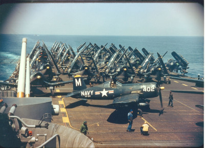 F4U-4 Corsair aircraft of VF-24 are on the deck of USS Philippean Sea (CV-47) of the coast of Korea_ 1951.jpg
